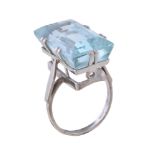 An aquamarine ring, the rectangular cut aquamarine in a claw setting, stamped 18ct, finger size N