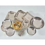 A collection of silver ashtrays, to include: a square ashtray by A. & J. Zimmerman Ltd.,