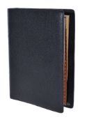 Gucci, a black leather address book, the interior with gilt edged lined paper with brown leather