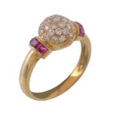A ruby and diamond bombe ring, set with a central cluster of brilliant cut diamonds, approximately