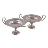 A pair of silver twin handled comports by Thomas, Walter & Henry Holland, London 1901, with twin