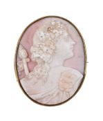 A 19th century conch shell cameo, the oval cameo carved with a bacchante, within a gold setting, 4.