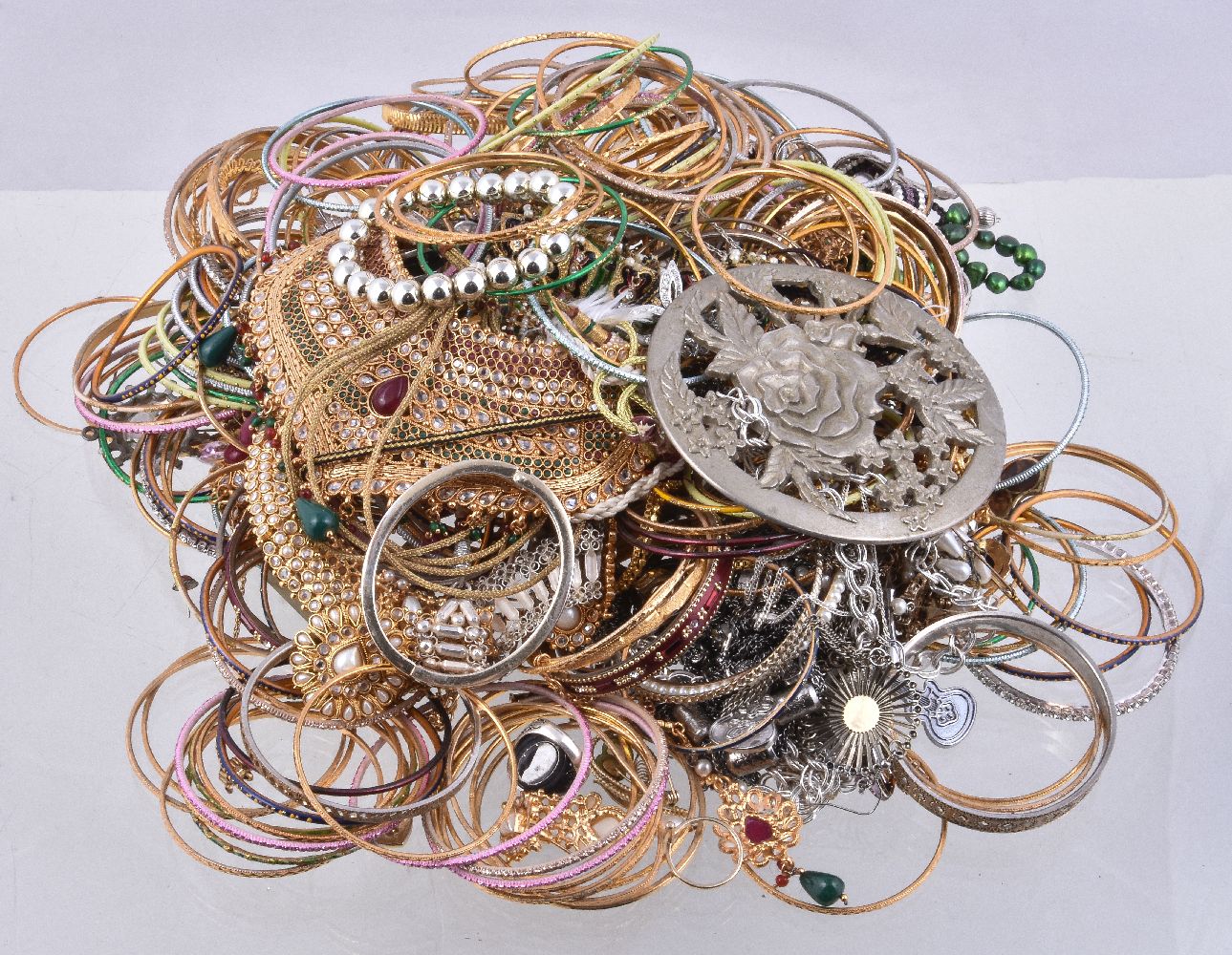 A collection of silver coloured jewellery and costume jewellery, including: various bangles;