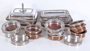 A collection of electro-plated items, to include: a set of four bottle coasters, the shaped circular