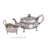 ϒ A late Victorian silver tea pot and cream boat by Horace Woodward & Co Ltd, London 1895