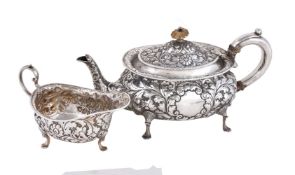 ϒ A late Victorian silver tea pot and cream boat by Horace Woodward & Co Ltd, London 1895