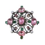 An Austro Hungarian foil backed topaz, emerald, half pearl and enamel brooch, circa 1900, the