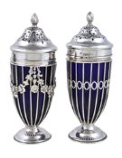 Two similar late Victorian silver and blue glass sugar castors by Haseler Brothers, London 1900 &
