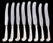 Twenty three silver handled steel pistol grip table knives, unmarked, 18th/19th century, most blades