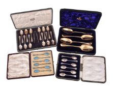 Four cased sets of silver spoons, comprising: four later gilt old English table spoons, at least