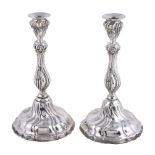 A pair of Spanish silver shaped circular candlesticks, maker's mark a device, post 1934 .915