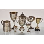 A collection of silver items, to include: a silver twin handled cup and cover by Charles S.