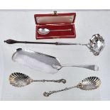 Five items of silver flatware, comprising: a late George II shaped oval toddy ladle, maker's mark