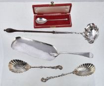 Five items of silver flatware, comprising: a late George II shaped oval toddy ladle, maker's mark