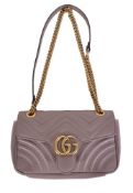 Gucci, GG Marmont, a beige quilted leather handbag, with a single leather handle, a curb link