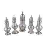 Five Georgian silver baluster castors, to include: a George II baluster castor by Samuel Wood,