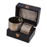 A pair of Aesthetic silver gilt circular napkin rings by James Dixon & Sons, Sheffield 1880, with