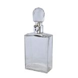 A silver mounted lockable decanter by Hukin & Heath Ltd, Birmingham 1926, with a cut glass rounded