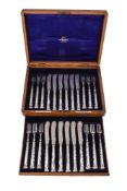 ϒ A set of twelve late Victorian silver and mother of pearl fruit knives and forks