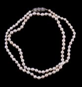 A natural pearl necklace, the one hundred and two pearls measuring from 2.9mm to 4mm, to a rose