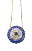 A synthetic gemstone evil eye pendant, the circular pendant set with circular cut synthetic