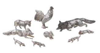 A group of eight silver miniature models of animals, comprising: a Dutch cockerel scent bottle,