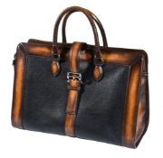 Berluti, a Venezia leather weekend bag, with rolled leather handles, crossover buckle fastening, and