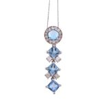 A blue topaz and diamond pendant, the circular cabochon blue topaz within a surround of old cut