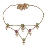 An Edwardian peridot, pink tourmaline and seed pearl necklace, circa 1910, the front section set