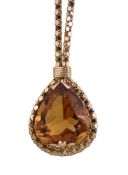 An Italian 18 carat gold citrine necklace, the pear shaped citrine in a raised claw setting,