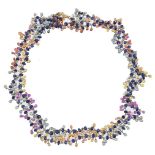 A gold and multi coloured sapphire necklace by Yvel, the gold links set with facetted sapphire beads