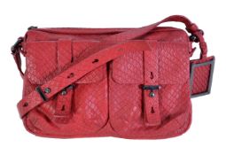 Marc Jacobs, a red leather shoulder bag, with a red leather shoulder strap, two outside pockets,