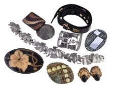 A collection of belts and buckles, to include a belt by Oipan, the brown belt with beaded and