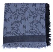 Chanel, a silk and wool grey shawl, with the Chanel motif throughout, on a grey ground, to a black