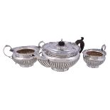 A late Victorian silver circular baluster three piece tea service by Henry Matthews, Birmingham