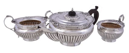 A late Victorian silver circular baluster three piece tea service by Henry Matthews, Birmingham