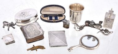 A collection of small silver and objects, including: a folding pocket double photograph frame,