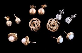 A collection of ear studs, to include a pair of knotted 9 carat gold and cultured pearl set ear