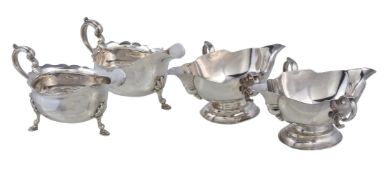 A pair of Edwardian silver shaped oval sauce boats by Thomas Bradbury & Sons, London 1902, with twin