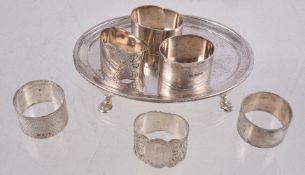 An Edwardian silver oval tea stand by Pairpoint Brothers, London 1905, with a raised moulded