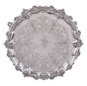 A Victorian silver shaped circular salver, maker's mark .. .R, London 1856, with a scroll and