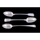 Three George III silver gravy spoons, comprising: a pair in fiddle pattern by William Esterbrook,