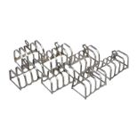 A matched set of seven four division toast racks, four by Adie Brothers Ltd., Birmingham 1933, three