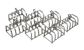 A matched set of seven four division toast racks, four by Adie Brothers Ltd., Birmingham 1933, three