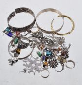 A collection of silver coloured jewellery, including: two enamelled bell bracelets, stamped Siam