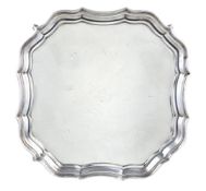 A silver shaped square salver by Barker Brothers, Chester 1922, with a raised moulded border,