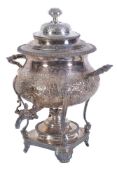 An electro-plated baluster tea urn, the associated domed lid with a chased foliate finial, twin