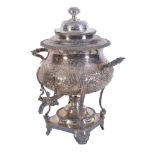 An electro-plated baluster tea urn, the associated domed lid with a chased foliate finial, twin