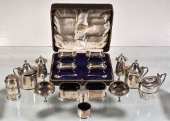 A collection of silver cruet items, mainly 20th century, including: a set of four oblong baluster