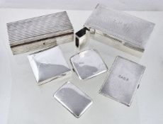 A collection of silver cigarette boxes and cases, to include: a silver rectangular cigarette box